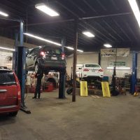 Cox Auto Service Vehicles Inside Garage